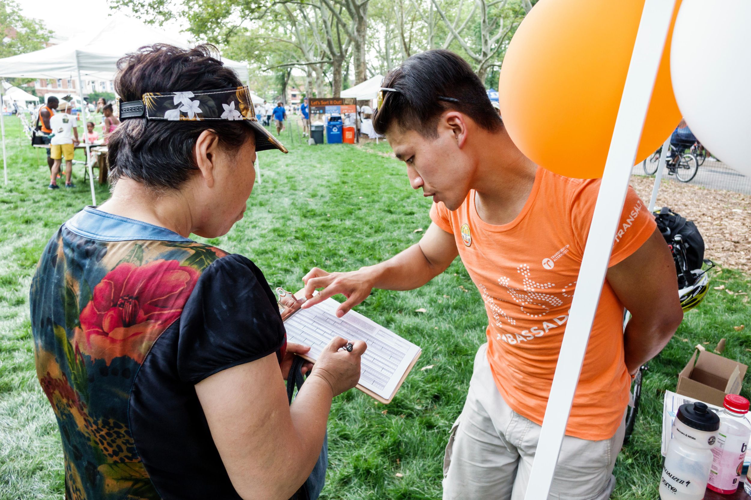 A man helps a woman at City of Water Day in New York in July 16, 2016
